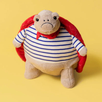 Grumpy Superhero Turtle Plush Toy – Striped Shirt & Red Cape
 - 30 cm