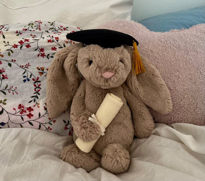 A 30 cm cute plush graduation bunny holding a degree and wearing a mortarboard cap.03