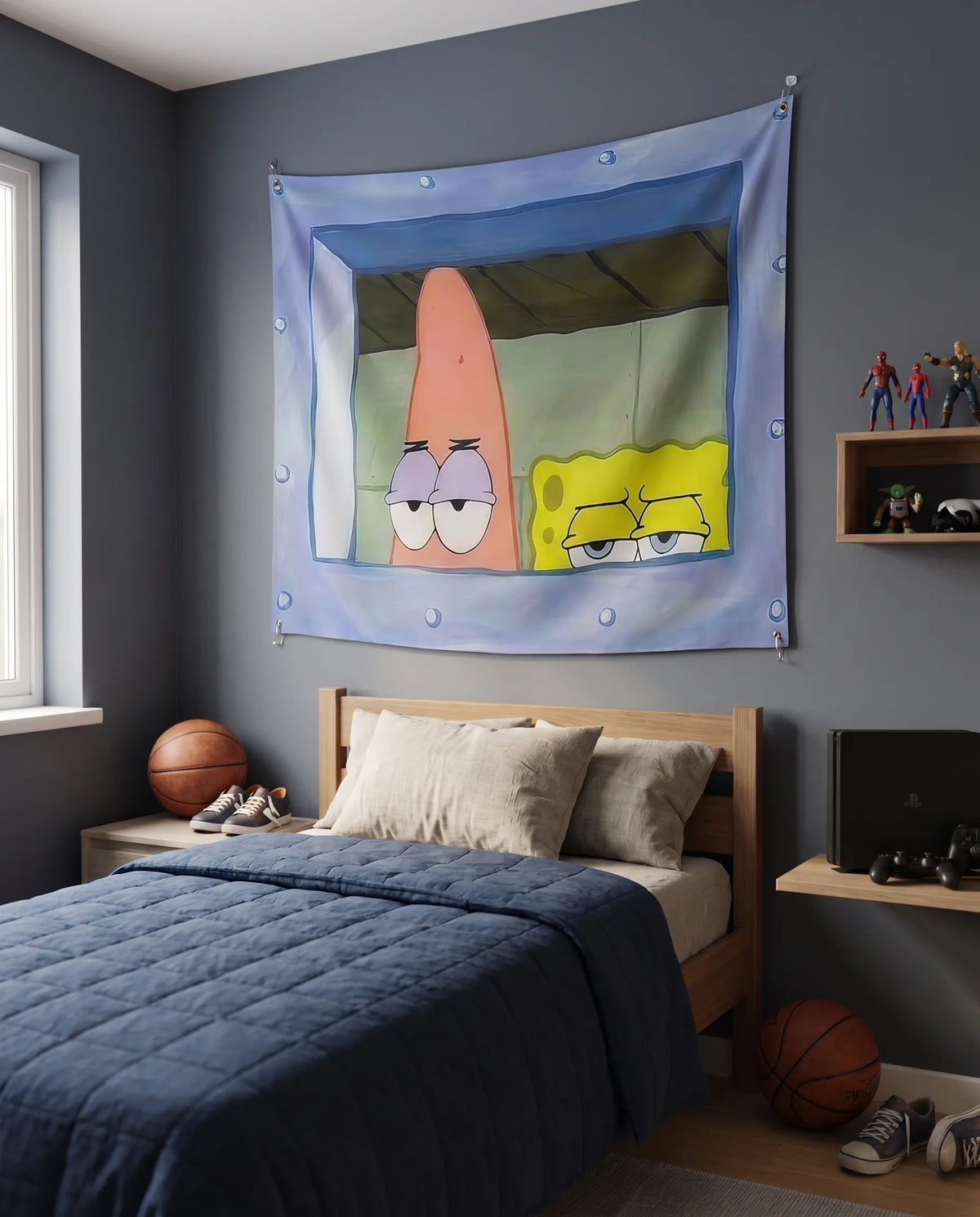 A SpongeBob-themed wall tapestry featuring Patrick Star and SpongeBob SquarePants, hung on a dark gray wall in a styled bedroom setting with a bed, basketballs, and shelves.