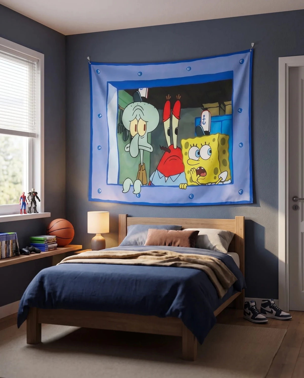 A SpongeBob-themed wall tapestry featuring Squidward, Patrick, and Gary hanging on a dark blue wall above a bed in a styled bedroom.